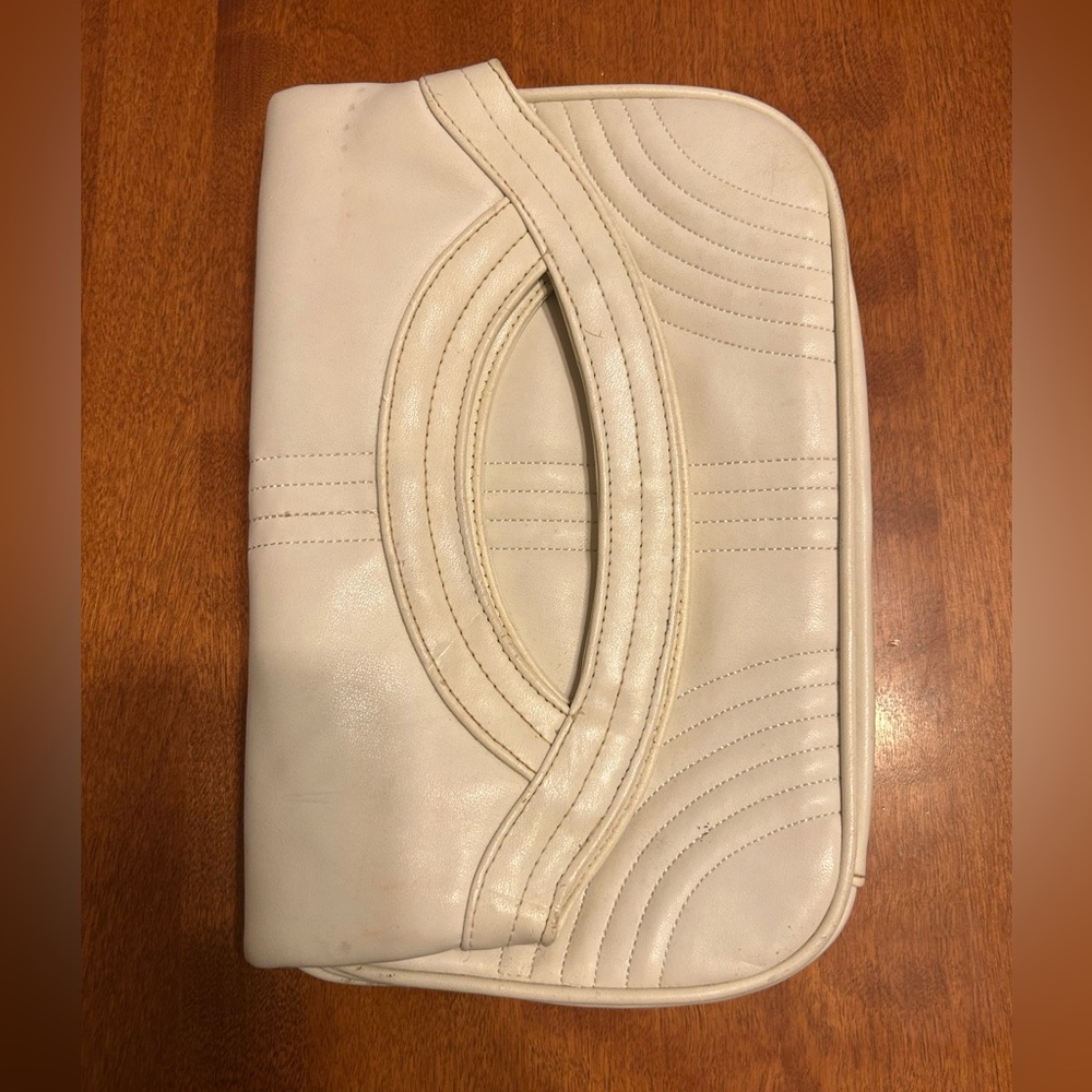 White clutch with pink lining